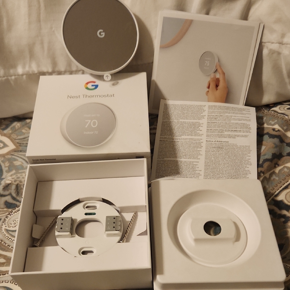 google Nest Thermostat in White and Silver